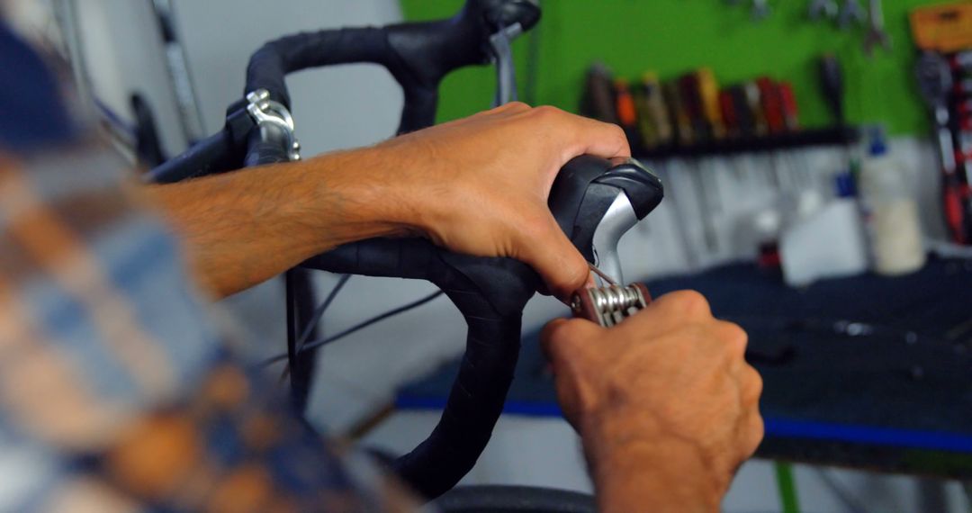 Mechanic Repairing Bicycle Brakes in Workshop - Free Images, Stock Photos and Pictures on Pikwizard.com