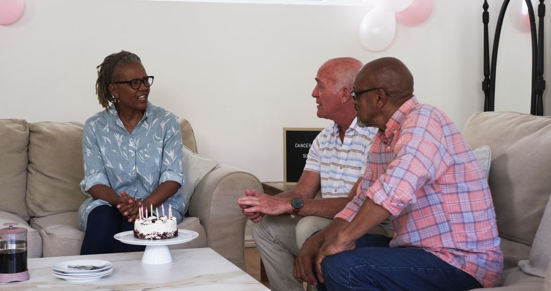 Senior Friends Sharing Joyful Home Gathering with Cake