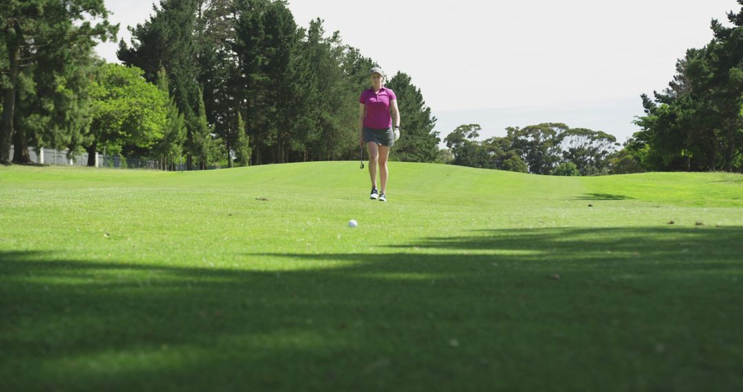 Female Golfer Standing on Lush Green Golf Course - Free Images, Stock Photos and Pictures on Pikwizard.com