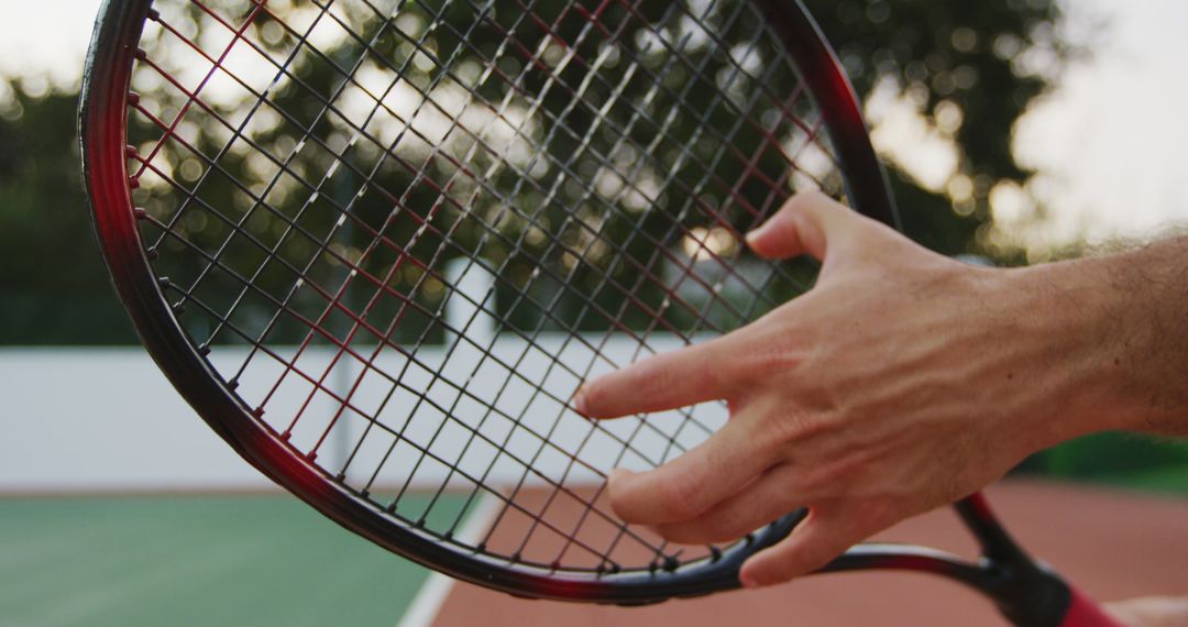 Close-Up of Tennis Player Gripping Racket on Court - Free Images, Stock Photos and Pictures on Pikwizard.com