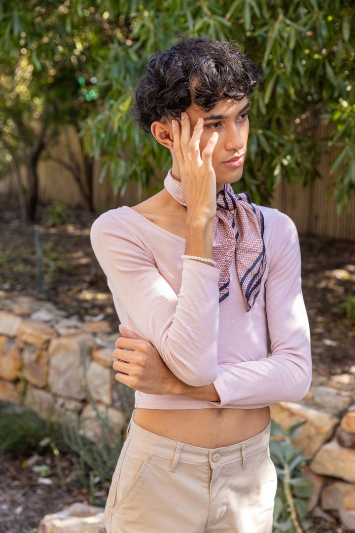 Stylish Young Man Contemplating in Serene Garden