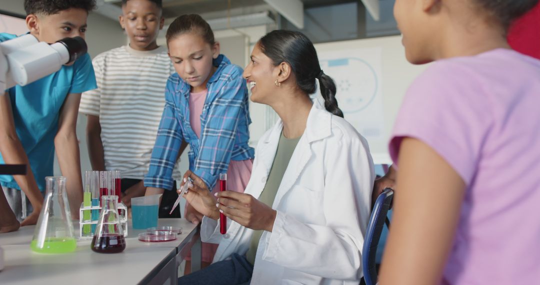 Teacher Exploring Chemistry Concepts with Students in School Laboratory