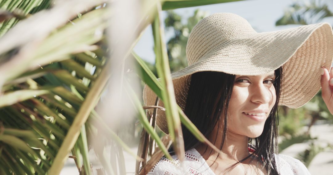 Young Woman Smiling in Sun Hat at Beachside Tropical Destination - Free Images, Stock Photos and Pictures on Pikwizard.com