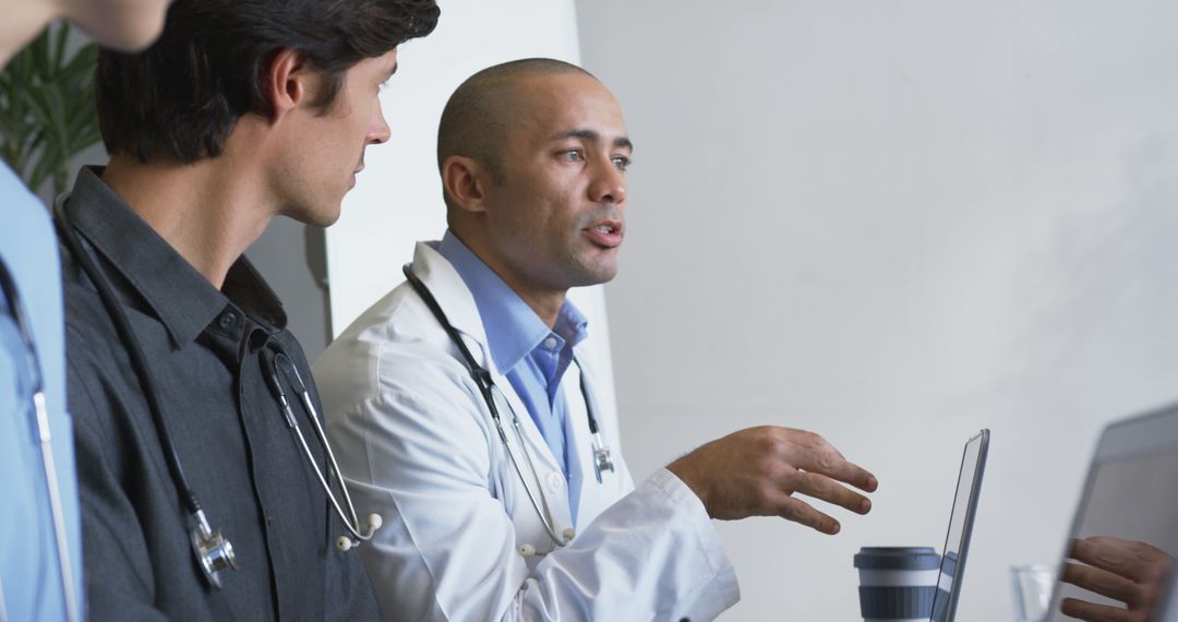 Doctors in Discussion During Hospital Meeting - Free Images, Stock Photos and Pictures on Pikwizard.com