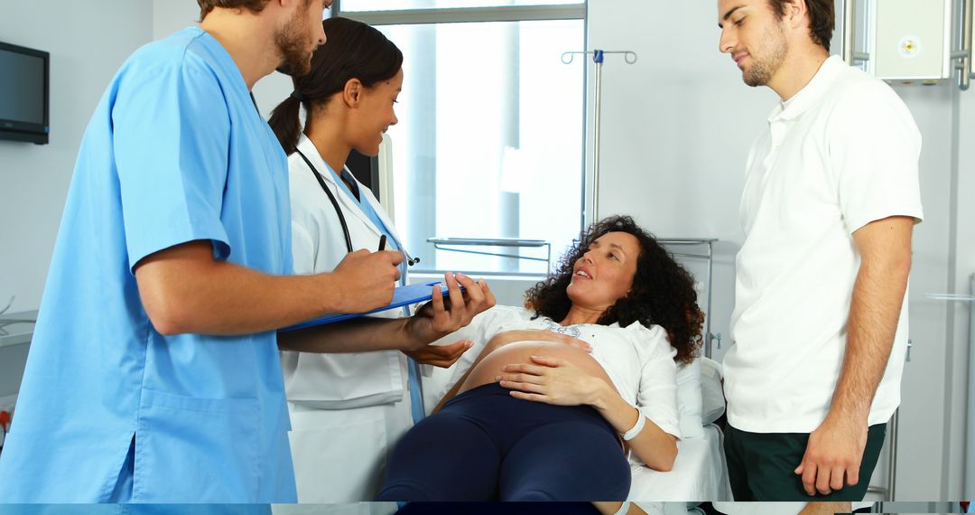 Medical team provides collaborative prenatal care to an expectant mother. - Free Images, Stock Photos and Pictures on Pikwizard.com