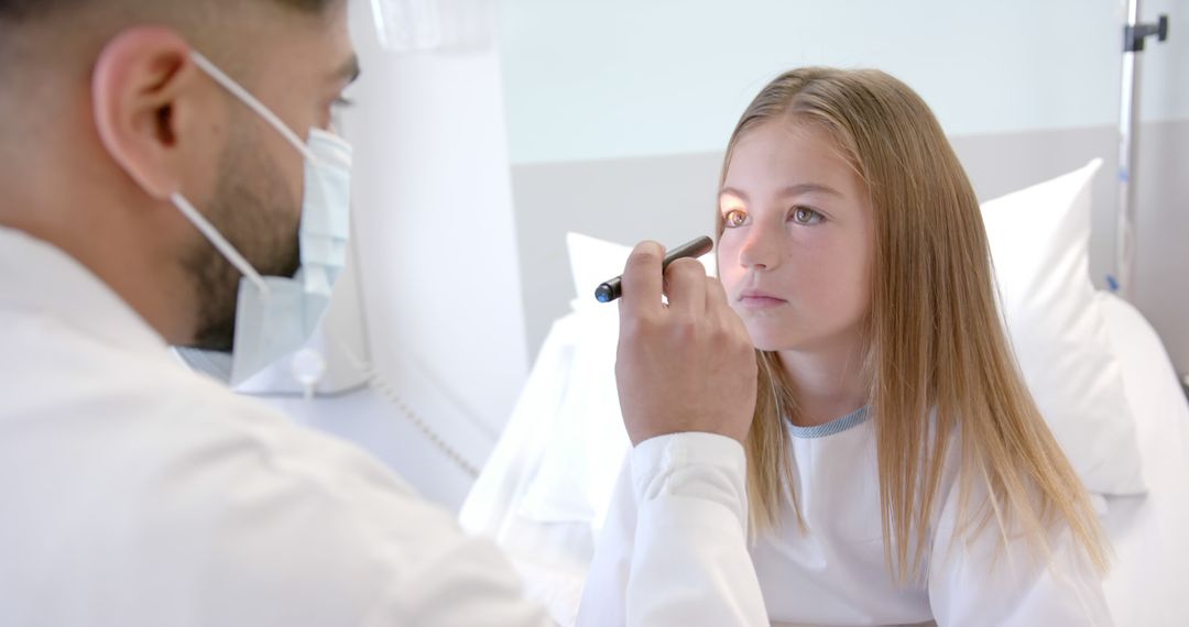 Doctor Performing Eye Examination on Young Patient in Hospital - Free Images, Stock Photos and Pictures on Pikwizard.com