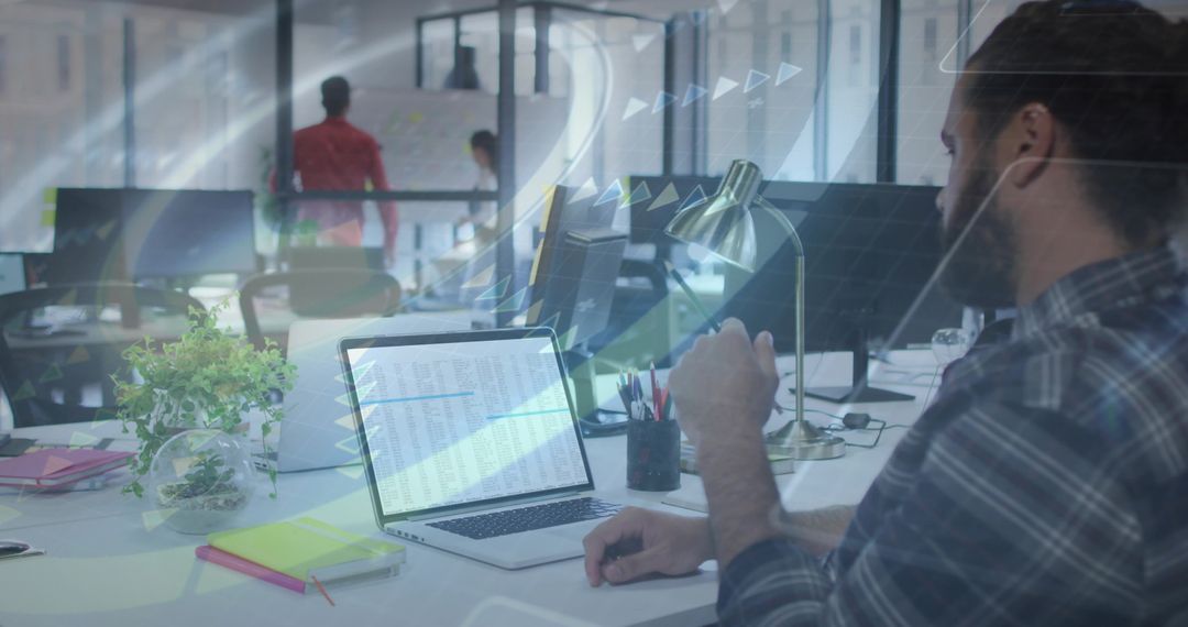 Modern Office Worker Collaborating in Innovative Workspace with Laptop