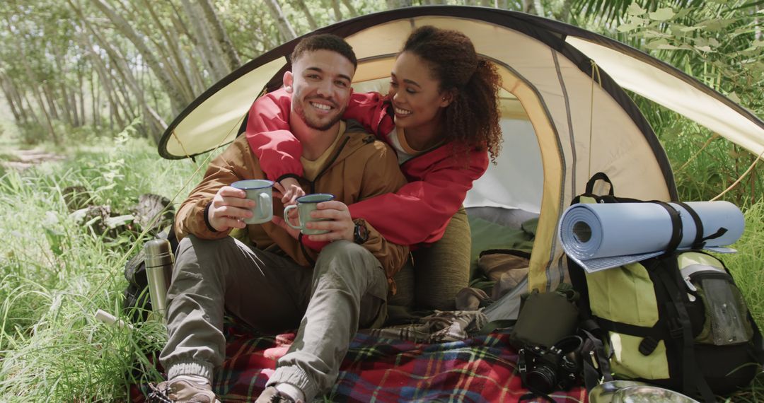 Couple Enjoying Coffee During Camping Trip in Nature - Free Images, Stock Photos and Pictures on Pikwizard.com