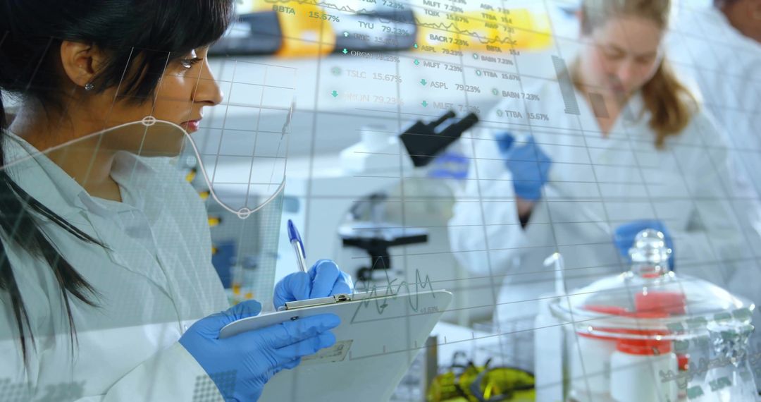 Researchers Analyzing Data in Laboratory with Technological Overlay