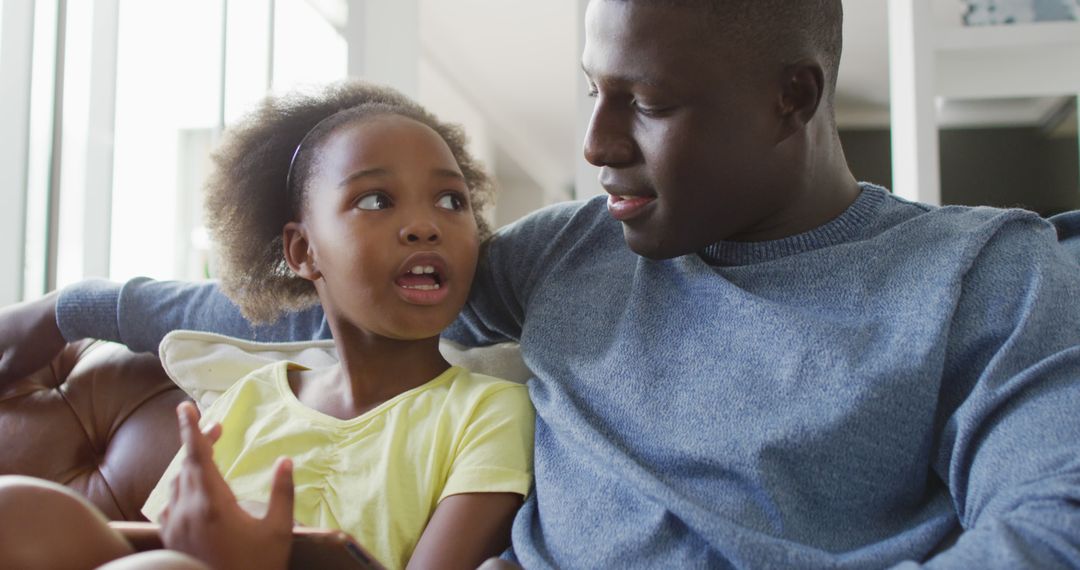 Father and Daughter Engaged in Enjoyable Family Interaction