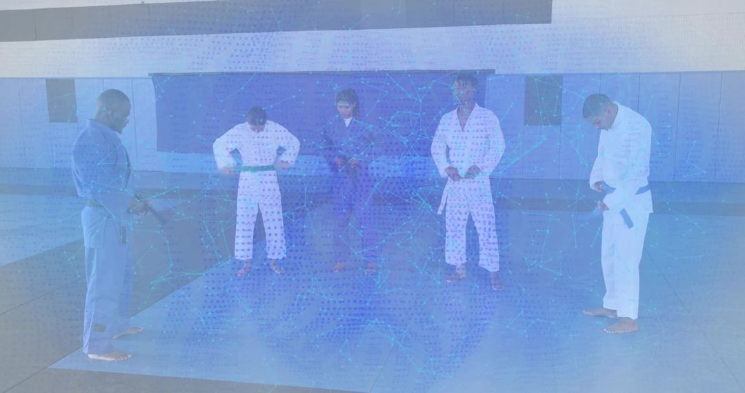 Martial arts students tying belts and preparing for jiu-jitsu training in modern dojo