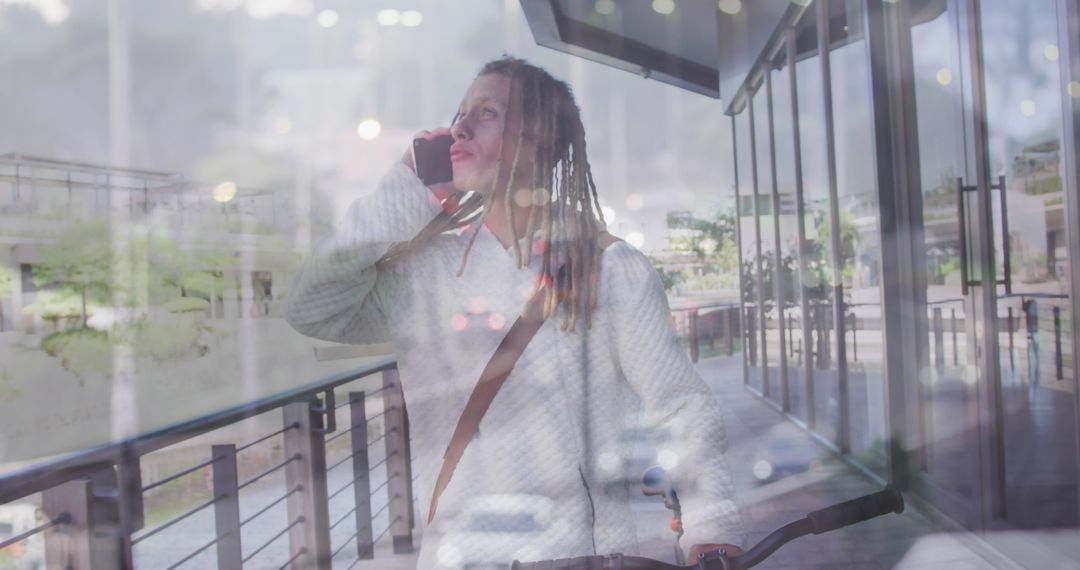 Biracial Man with Bike Talking on Smartphone Overlaid with Traffic