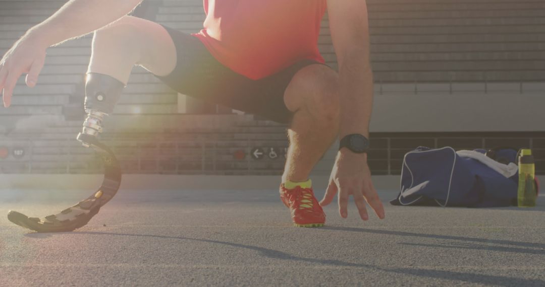 Disabled Athlete Warming Up on Track in Sunlight