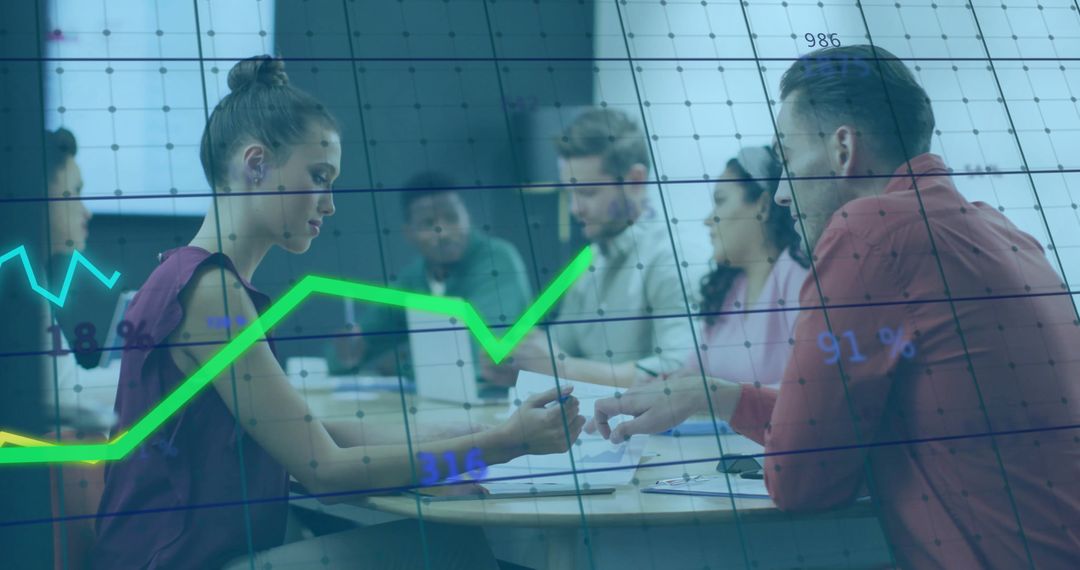 Diverse Team Collaborating Over Analytics in Modern Office Setting