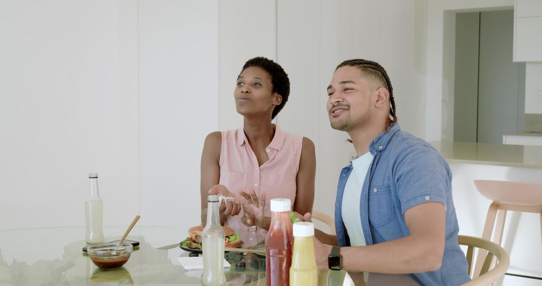 Couple Enjoying Meal Together in Modern Home Setting