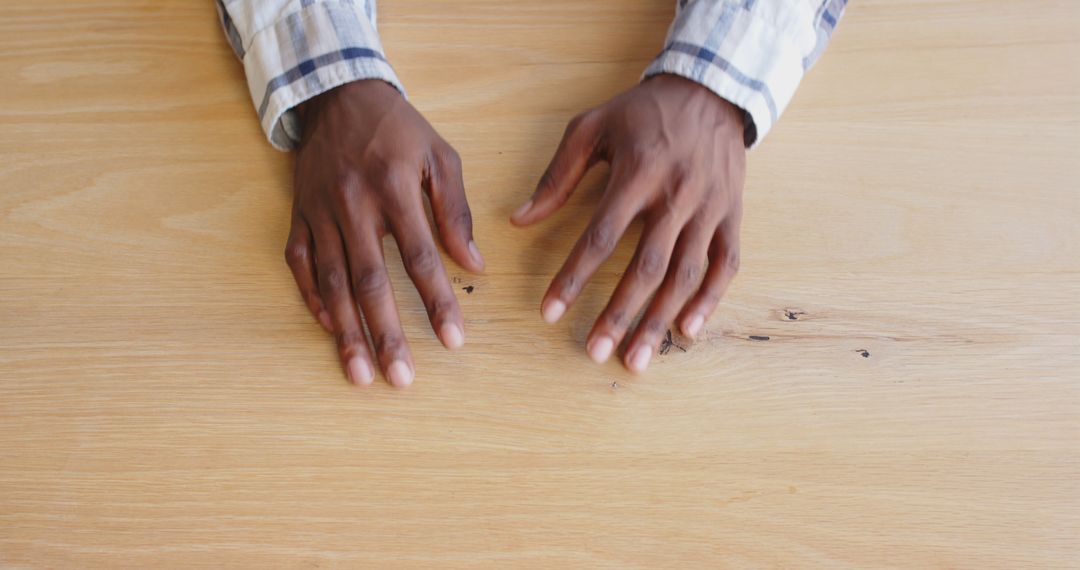 Business Professional Gesturing Hands on Wooden Desk during Discussion
