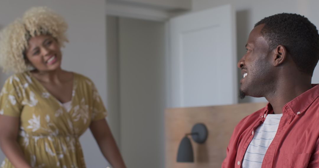 Couple Sharing Laughter in Relaxed Home Environment