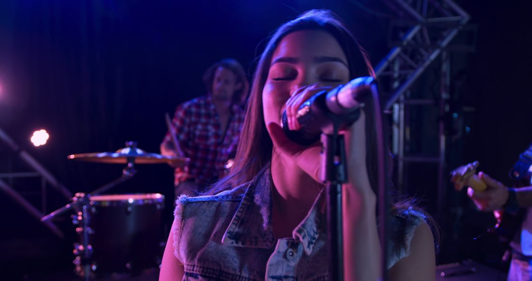 Caucasian Female Singer Rehearsing at Band Practice