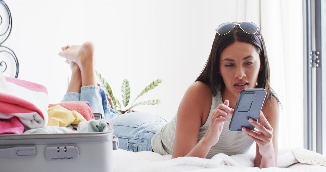 Woman Relaxed Exploring Phone While Preparing for Trip