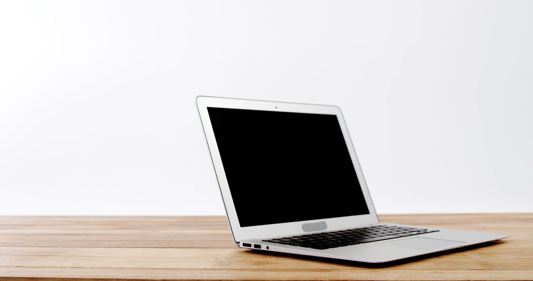 Open Laptop on Wooden Desk with Clean White Background - Free Images, Stock Photos and Pictures on Pikwizard.com