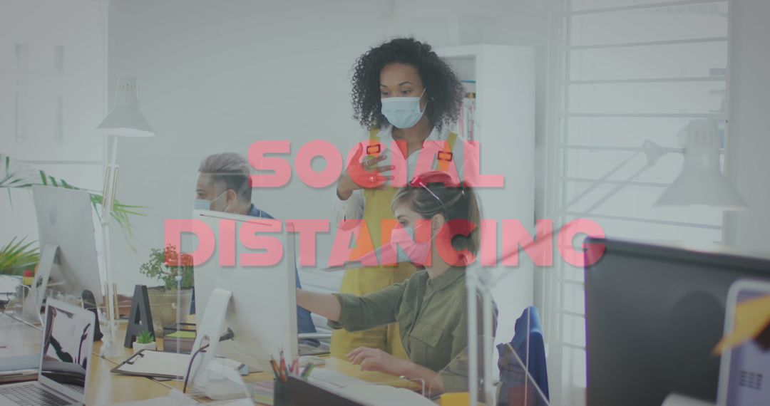 Office Workers Maintaining Social Distancing During Pandemic