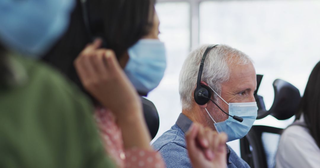 Call Center Employees Wearing Face Masks and Headsets - Free Images, Stock Photos and Pictures on Pikwizard.com