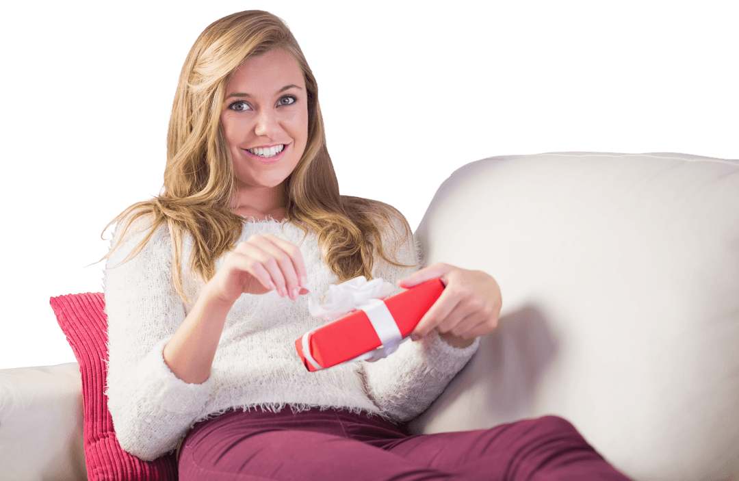 Smiling Woman on Couch Opening Gift Transparent Background