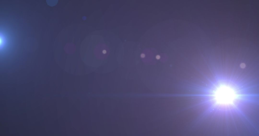 Lens Flare with Brilliant Spotlights in Dark Atmosphere