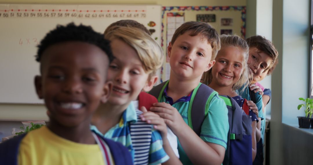 Diverse Group of Happy Schoolchildren Lining Up in Classroom - Free Images, Stock Photos and Pictures on Pikwizard.com