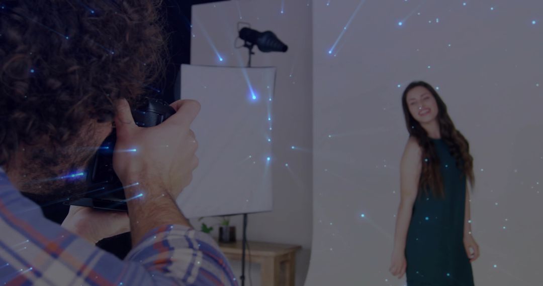 Professional Photographer Capturing Model in Studio with Lens Flare Effects