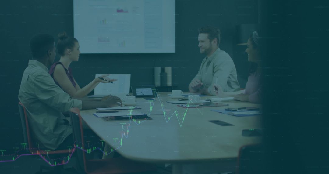 Diverse Team Engages in Lively Office Discussion with Data Visualizations