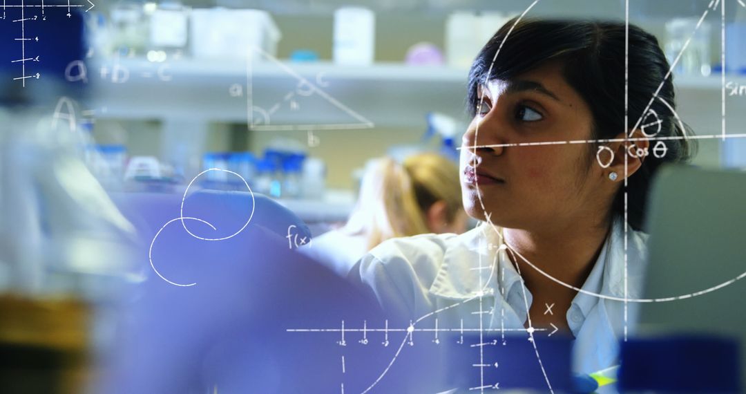 Female Scientist Analyzing Scientific Data in Laboratory Setting