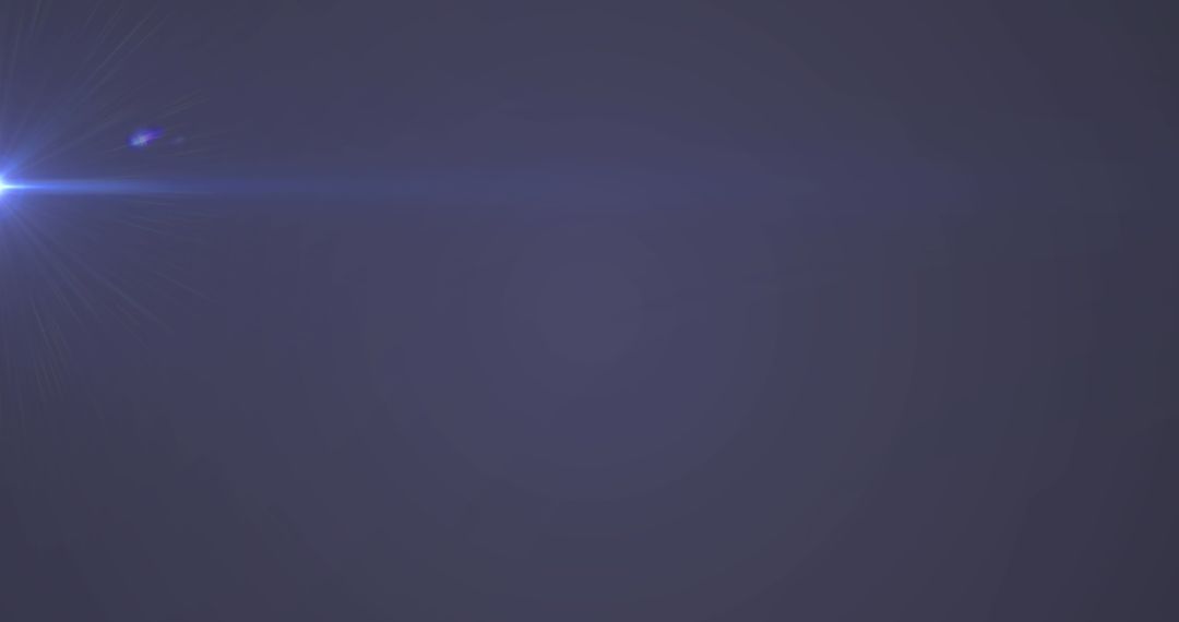 Glowing Blue Light on Purple Background with Subtle Lens Flare