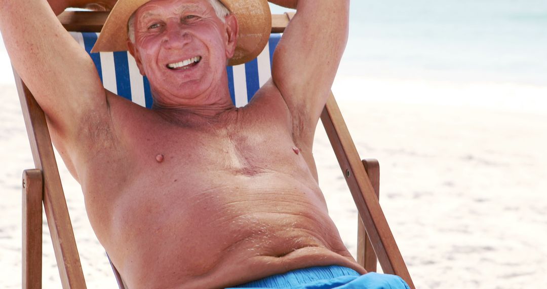 Senior Man Relaxing on Beach Lounger in the Sun - Free Images, Stock Photos and Pictures on Pikwizard.com