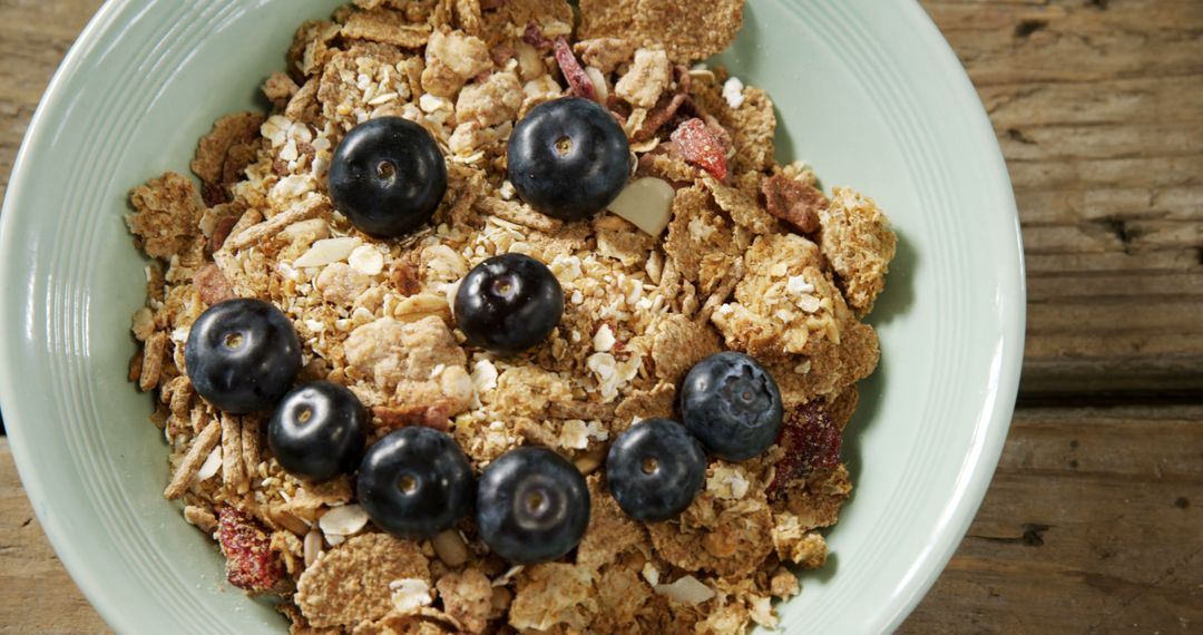 Bowl of Crunchy Granola with Blueberry Happy Face - Free Images, Stock Photos and Pictures on Pikwizard.com