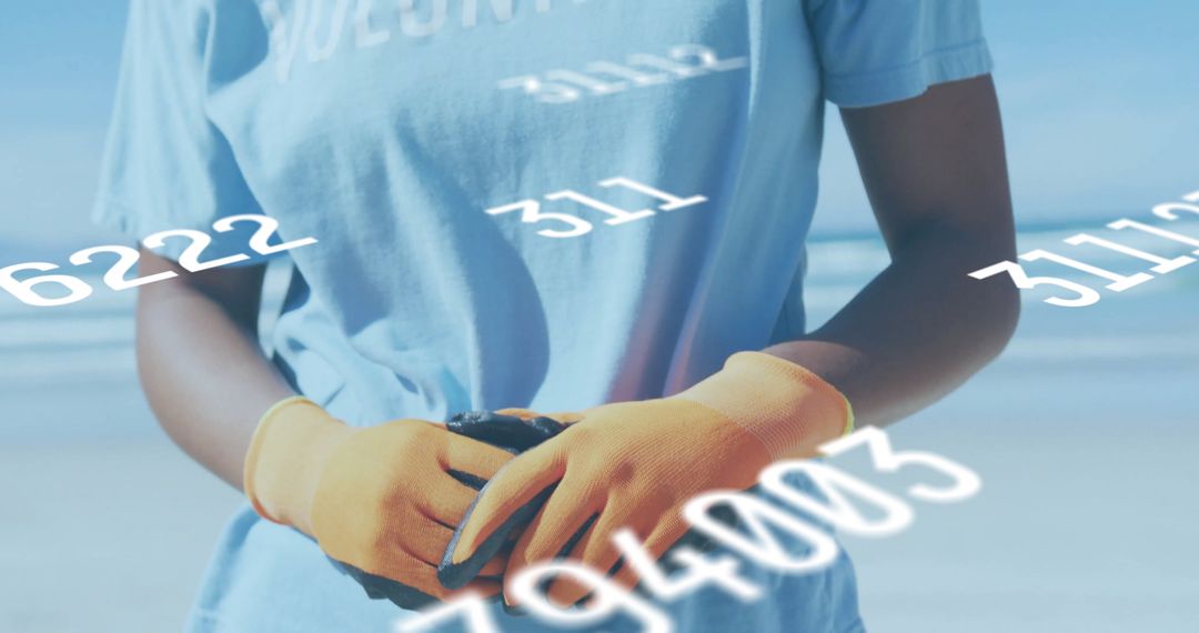 Volunteer Gathering Debris on Beach with Data Overlay