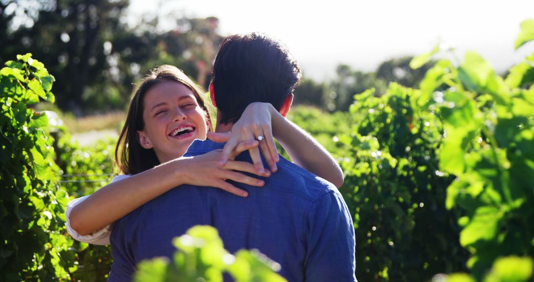 Happy Couple Embracing in a Green Vineyard - Free Images, Stock Photos and Pictures on Pikwizard.com