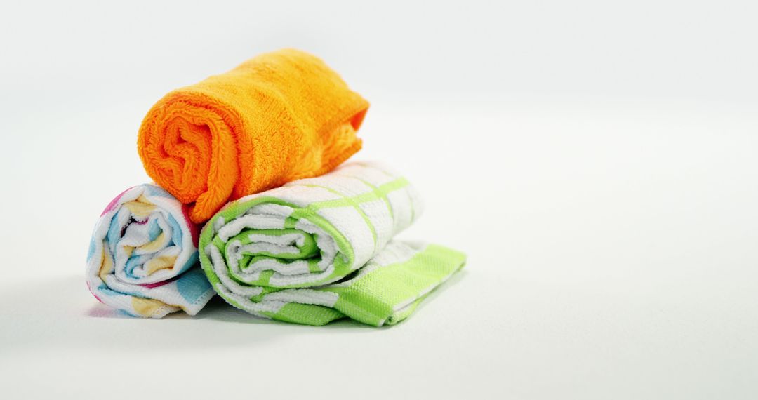 Rolled Colorful Towels on White Background - Free Images, Stock Photos and Pictures on Pikwizard.com