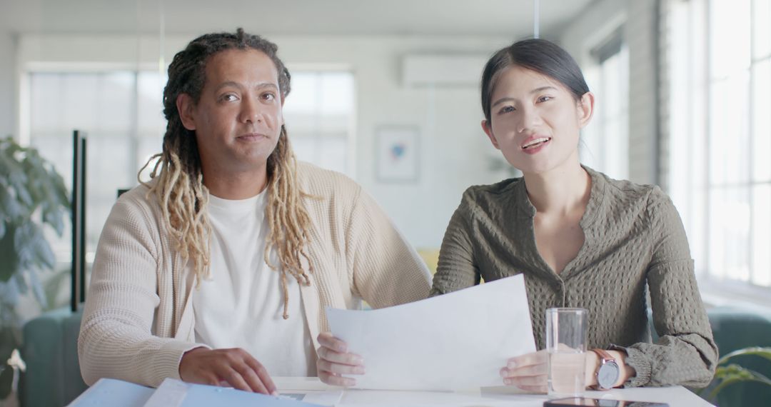 Diverse Colleagues in Virtual Meeting at Office Desk