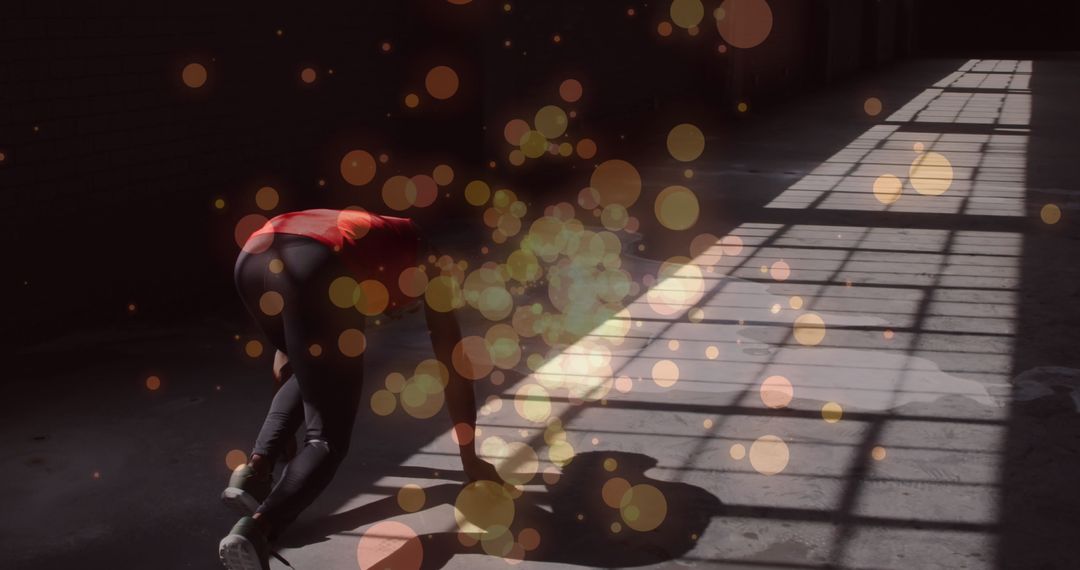 Athlete Poised on Starting Line with Bokeh Light Overlay