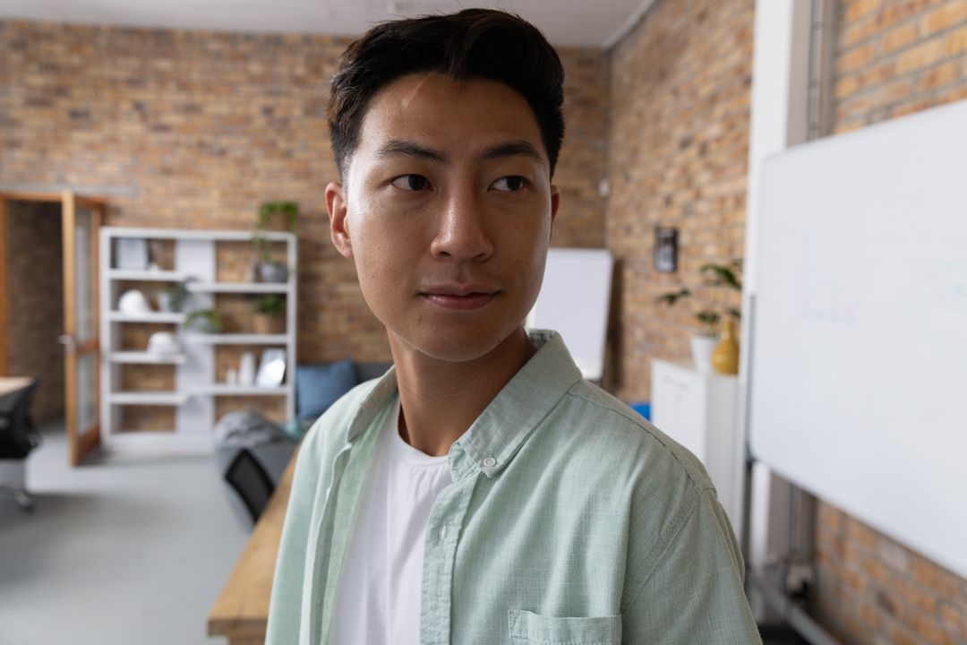 Confident Professional Working in Open Office Environment