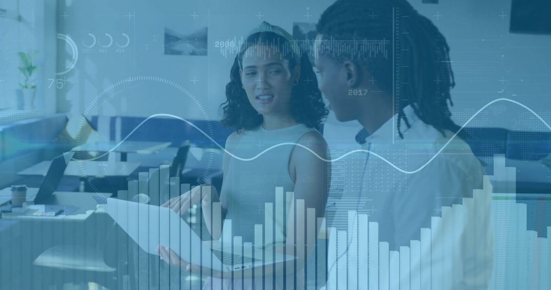 Collaborative Duo Analyzing Data in Modern Workspace