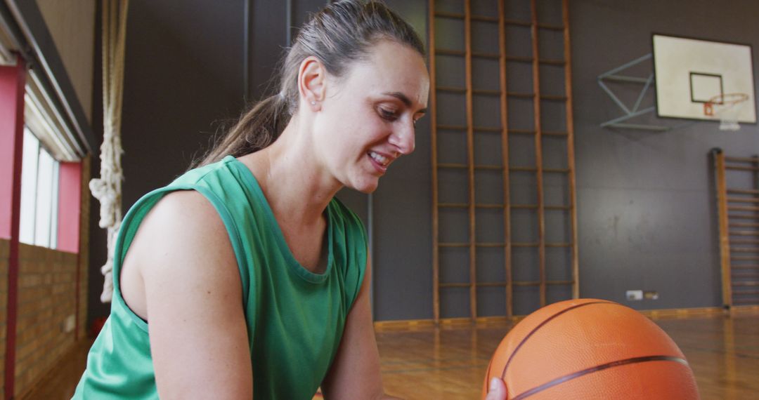 Woman Practicing Basketball Indoors in Gym - Free Images, Stock Photos and Pictures on Pikwizard.com