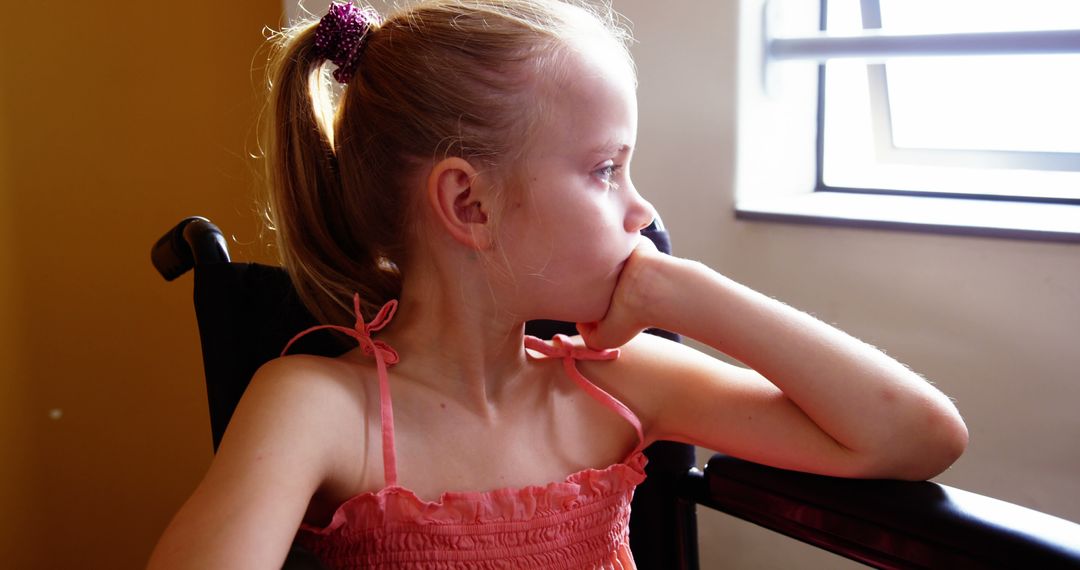 Pensive Girl in Red Dress Sitting by Window - Free Images, Stock Photos and Pictures on Pikwizard.com