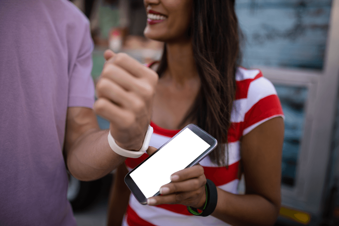 Couple Using Smartwatch for Contactless Transaction on Transparent Background
