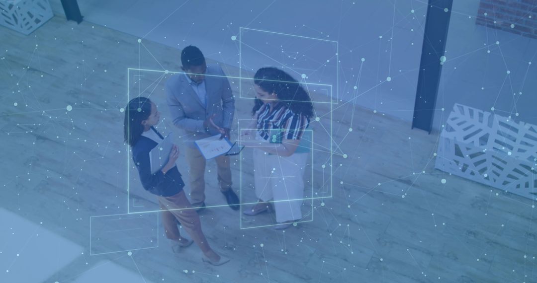 Business Team Reviewing Data with Digital Network Overlay Overhead View for Collaboration