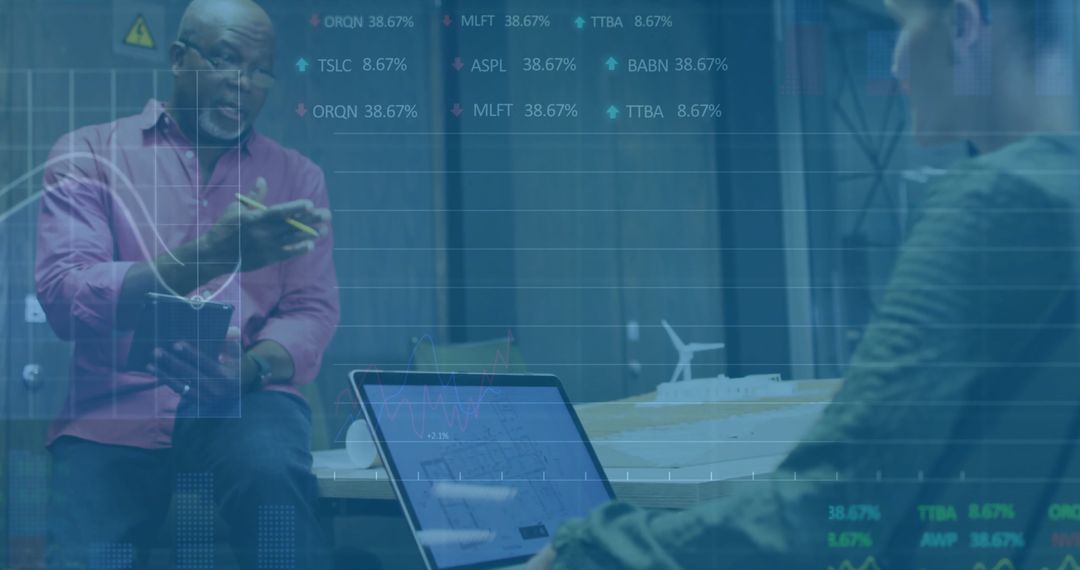 Senior Professional Discussing Sustainable Energy with Colleague