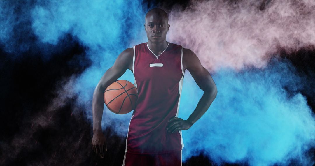 Confident Basketball Player Posed Amid Abstract Splash of Colors