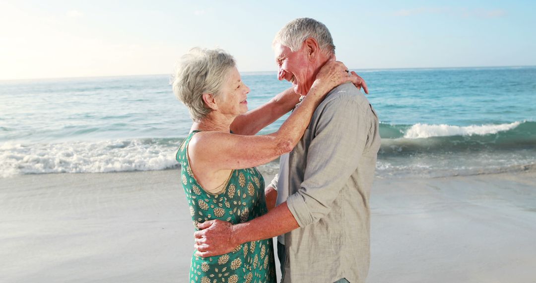 Retired Couple Dancing Joyfully on Beach at Sunset - Free Images, Stock Photos and Pictures on Pikwizard.com