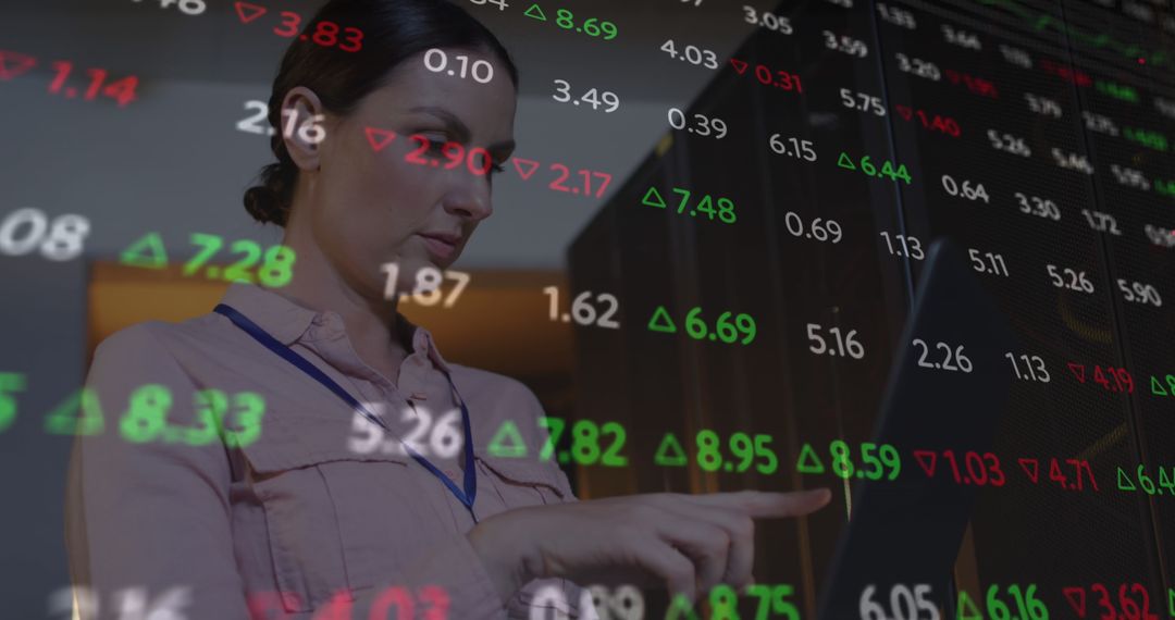 IT Engineer Analyzing Data on Digital Screen and Laptop